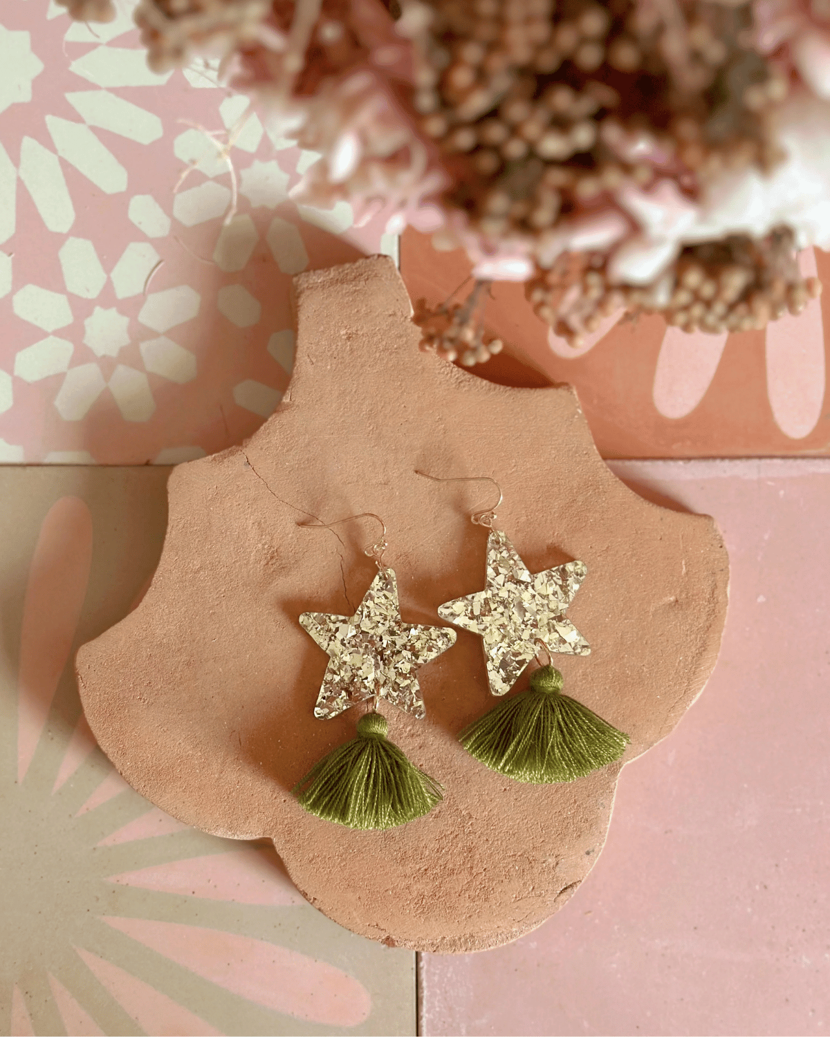 Hand drawn star design made from beautiful gold sparkle acrylic with an olive green tassel
