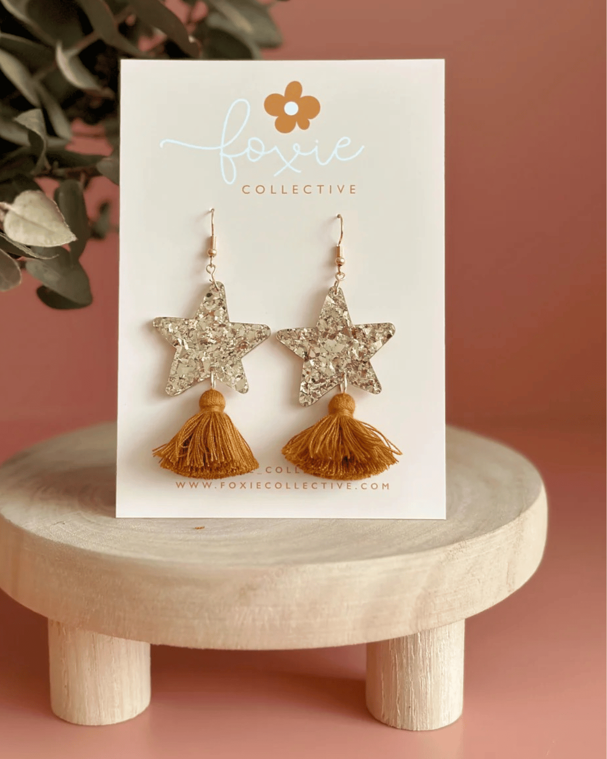 Hand drawn star design made from beautiful gold sparkle acrylic with a tan tassel