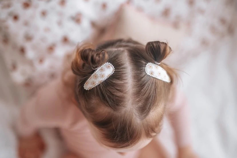 dainty dulcie pretty floral white and peach fabric hair clips in pigtail hair