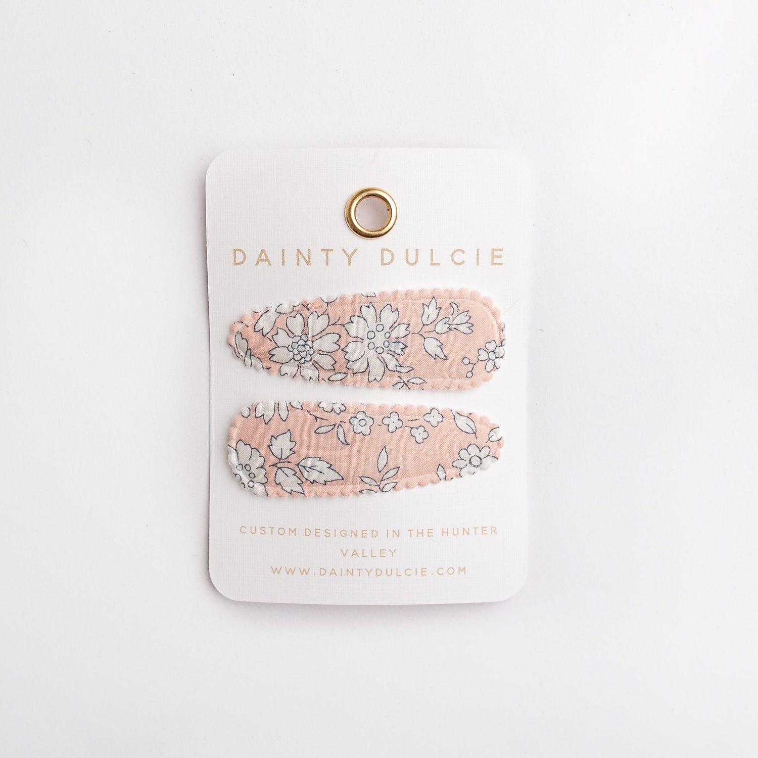 dainty dulcie kids handmade hair clips in pretty coral floral fabric